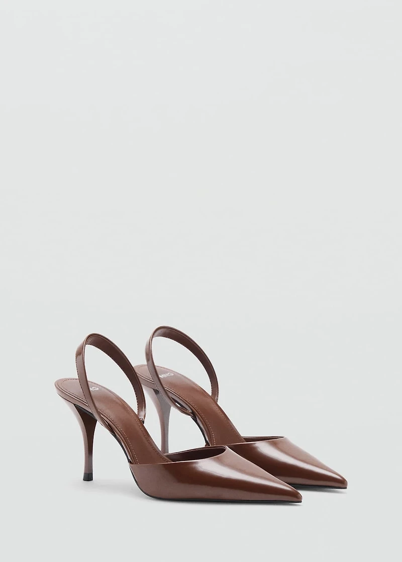 Pointed shoes with patent leather effect