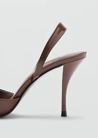 Pointed shoes with patent leather effect