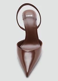 Pointed shoes with patent leather effect