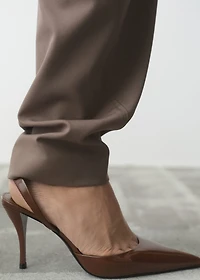 Pointed shoes with patent leather effect