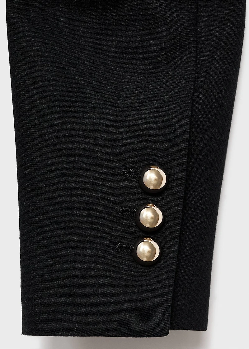Jacket with jewel-button strip collar