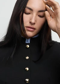 Jacket with jewel-button strip collar