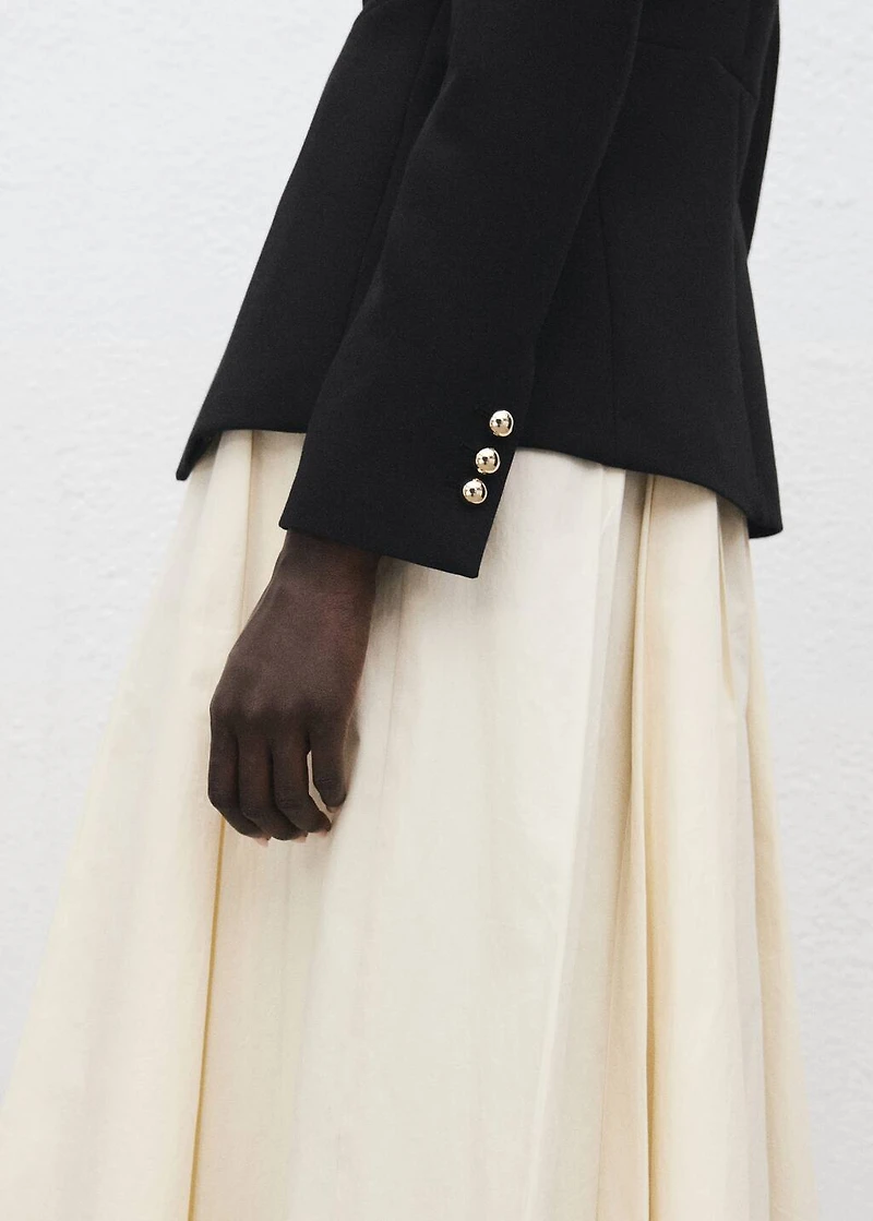 Jacket with jewel-button strip collar