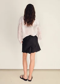 Satin shorts with embroidered hem