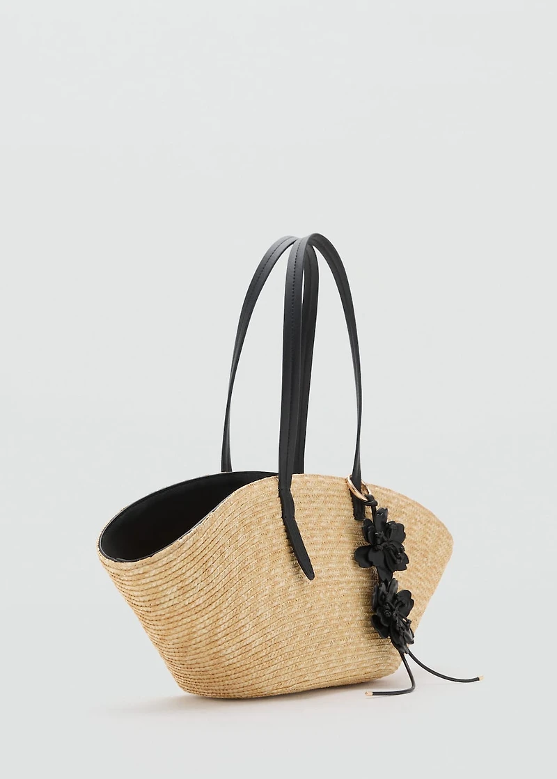 Natural fiber basket with flower charm