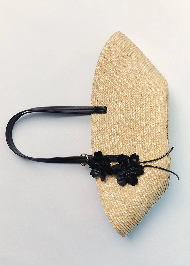 Natural fiber basket with flower charm