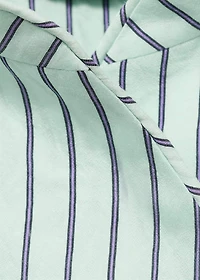 Striped top with a strap neckline and laces