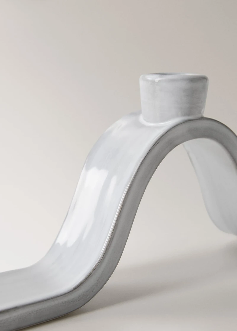 Stoneware candlestick with wave design and glossy finish