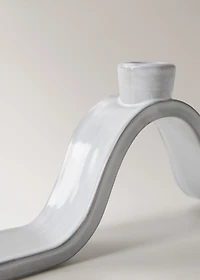 Stoneware candlestick with wave design and glossy finish
