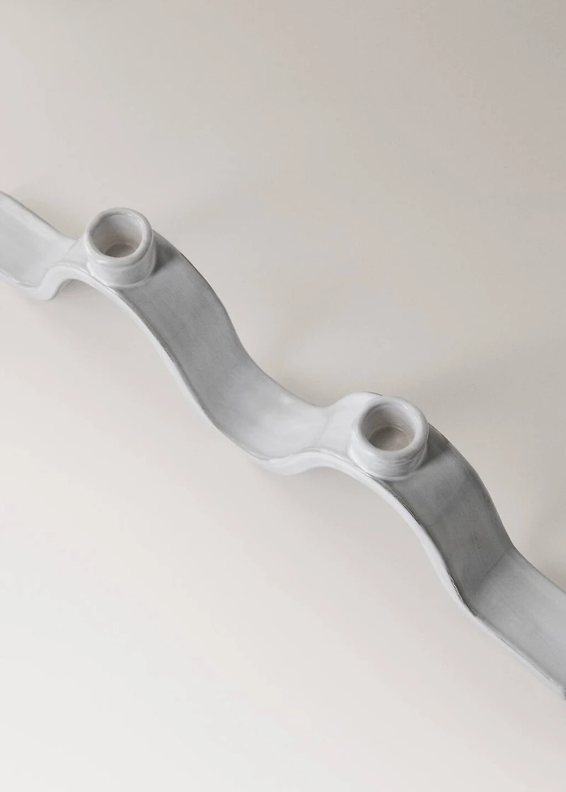 Stoneware candlestick with wave design and glossy finish