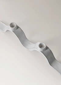 Stoneware candlestick with wave design and glossy finish