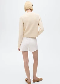 Knitted cardigan with frayed ends