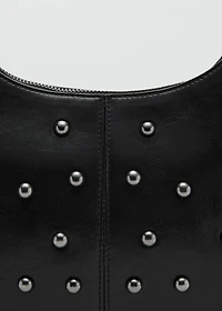 Studded clutch bag