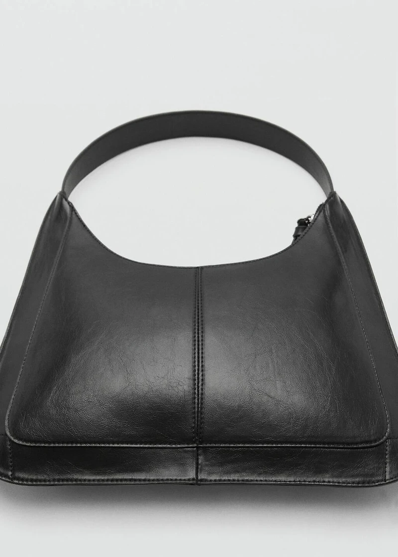 Studded clutch bag
