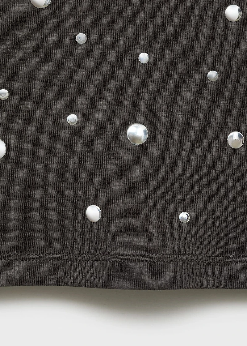 Halter top with metallic appliqués