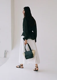 Small natural fiber basket with leather fringes