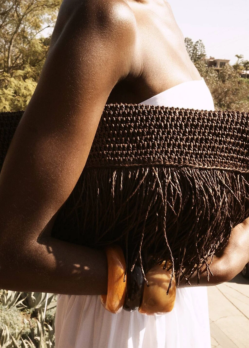 Natural fiber handbag with fringes