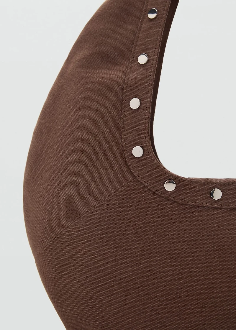 Oval studded shoulder bag