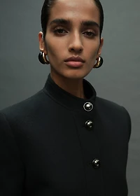 Jacket with jewel-button strip collar