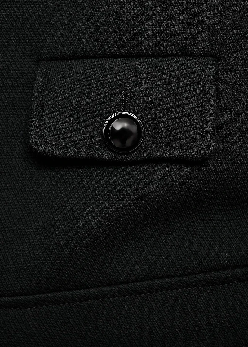 Jacket with jewel-button strip collar
