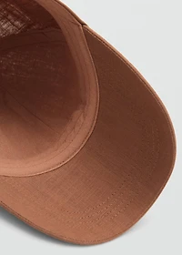 Linen-blend cap with embroidered message