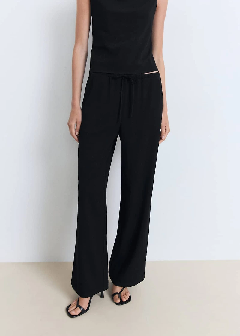 Asymmetrical draped top with straps