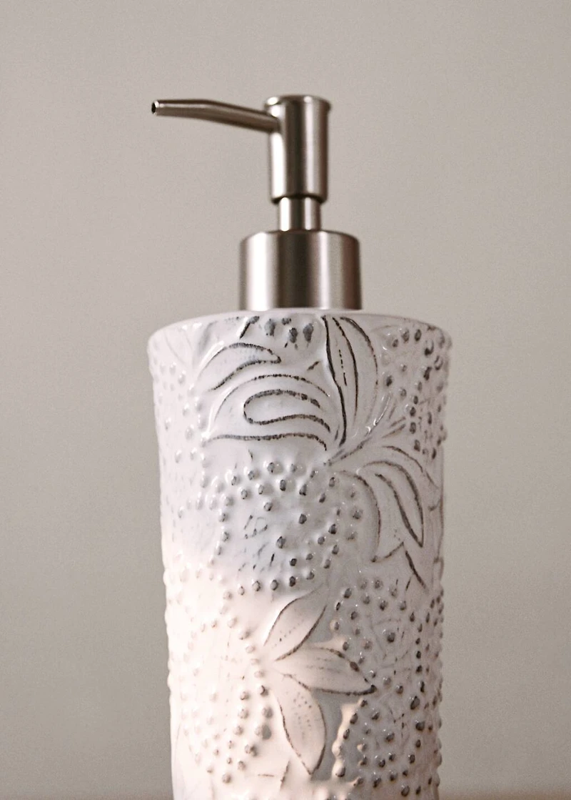 Embossed soap dispenser