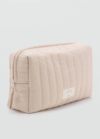 Textured toiletries bag