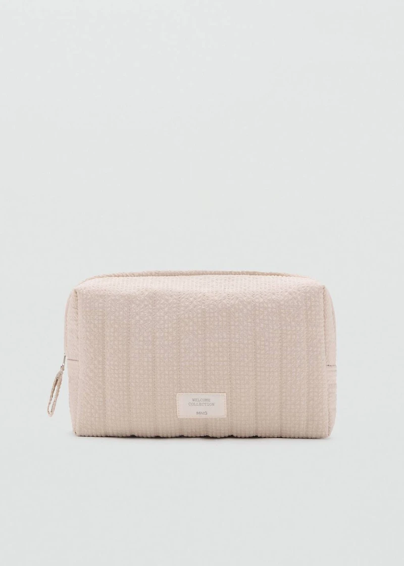 Textured toiletries bag