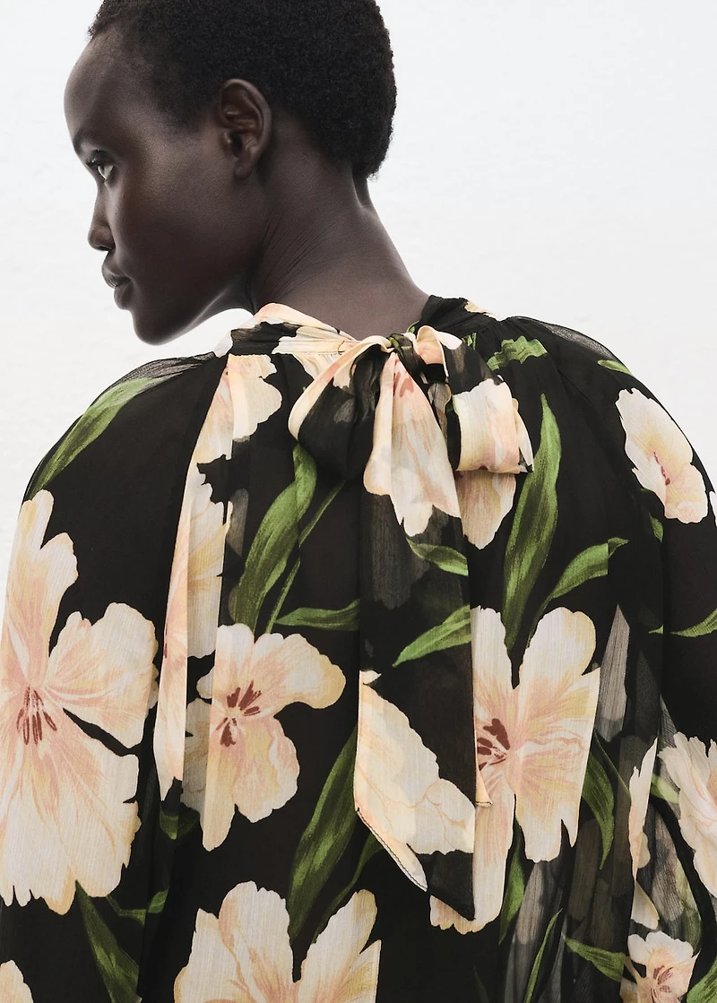 Semi-transparent floral blouse