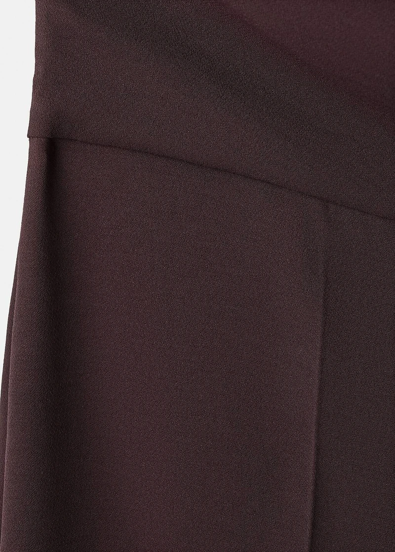 Jumpsuit with asymmetrical neck and bow