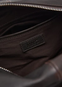 Leather clutch bag with charms