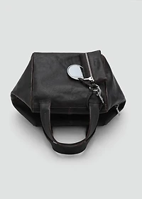 Leather clutch bag with charms