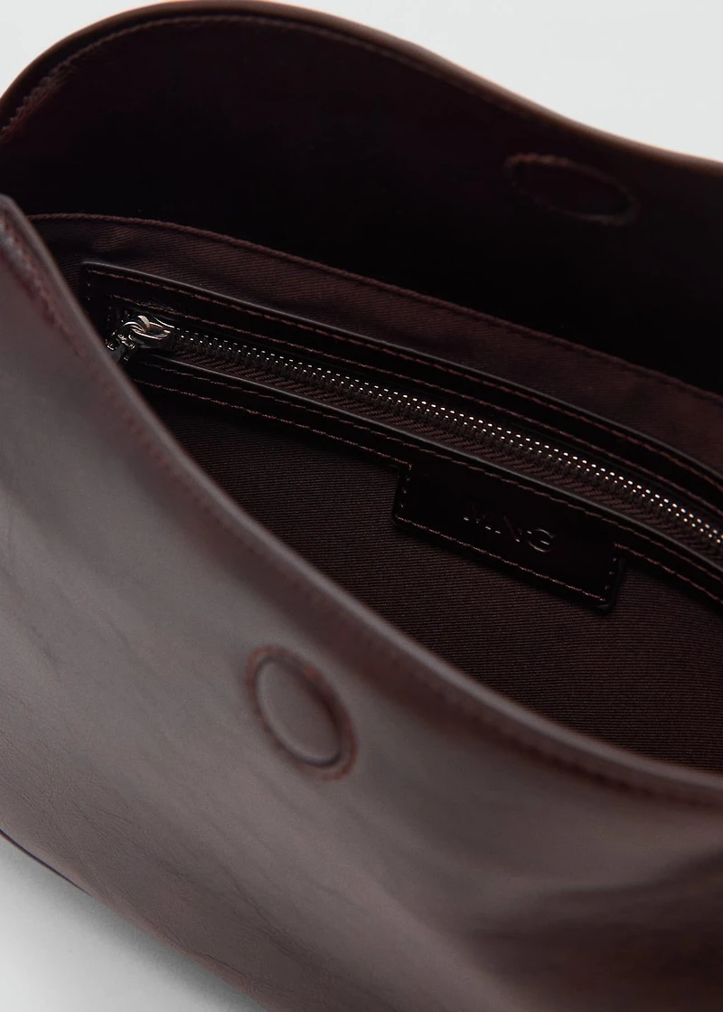 Oval shoulder bag with flap