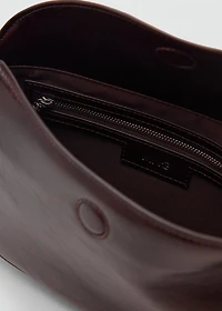 Oval shoulder bag with flap