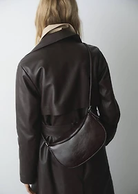 Oval shoulder bag with flap