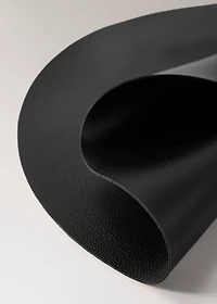 Round faux leather placemat