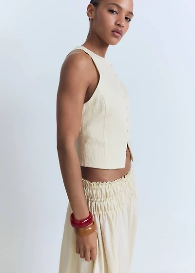 Vest with bow on the back
