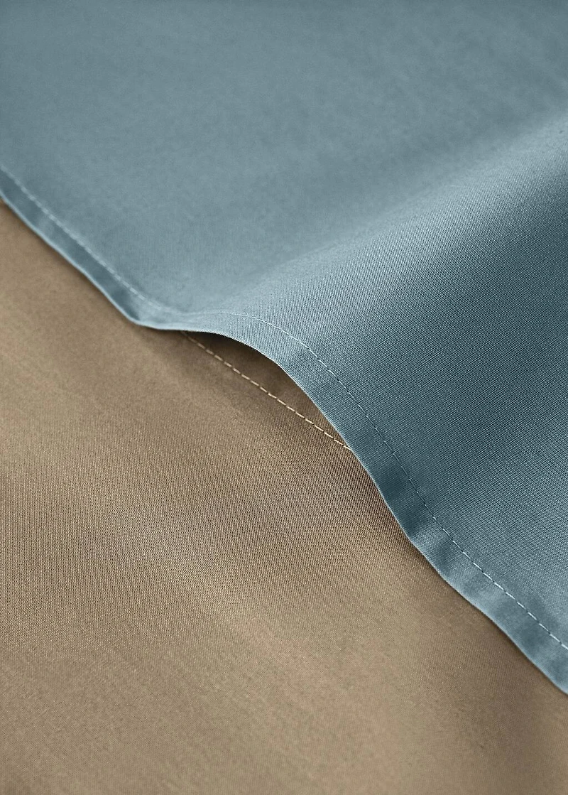 Reversible percale cotton duvet cover with contrasting piping for cot