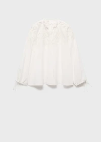 Embroidered blouse with bows