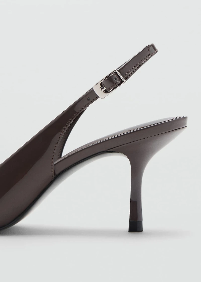 Pointed shoes with patent leather effect