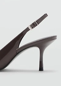 Pointed shoes with patent leather effect