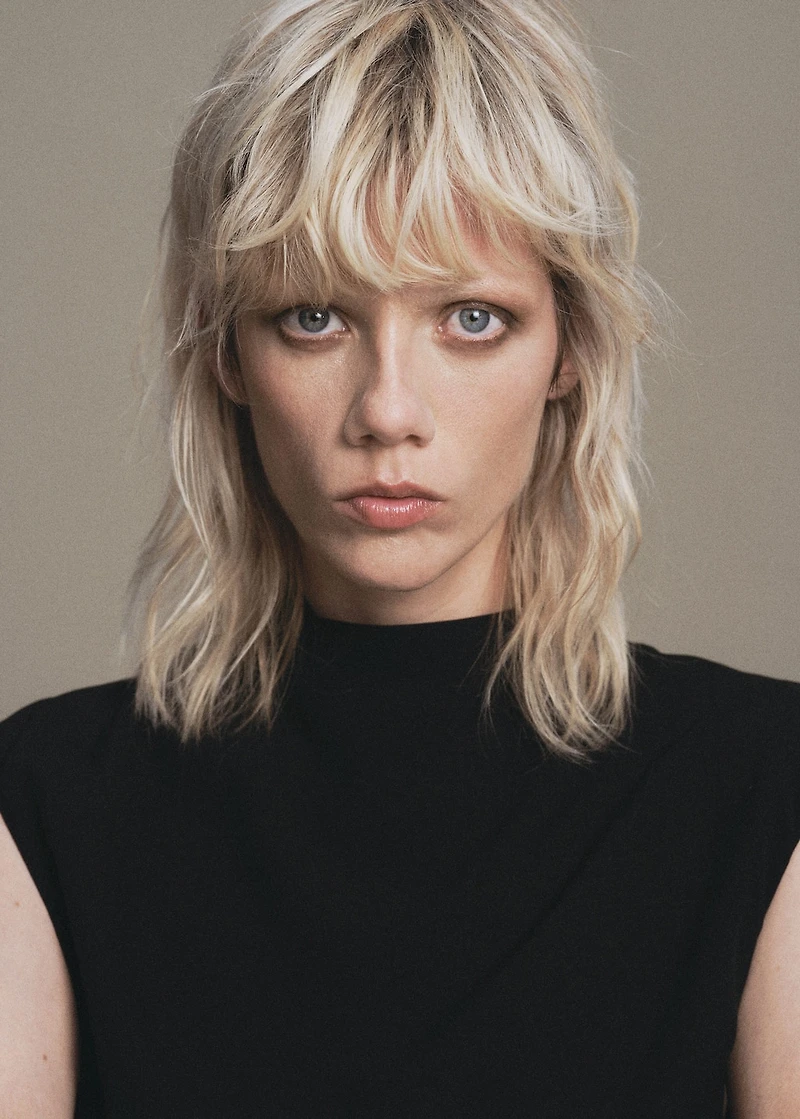 Jumpsuit with draped neck and belt