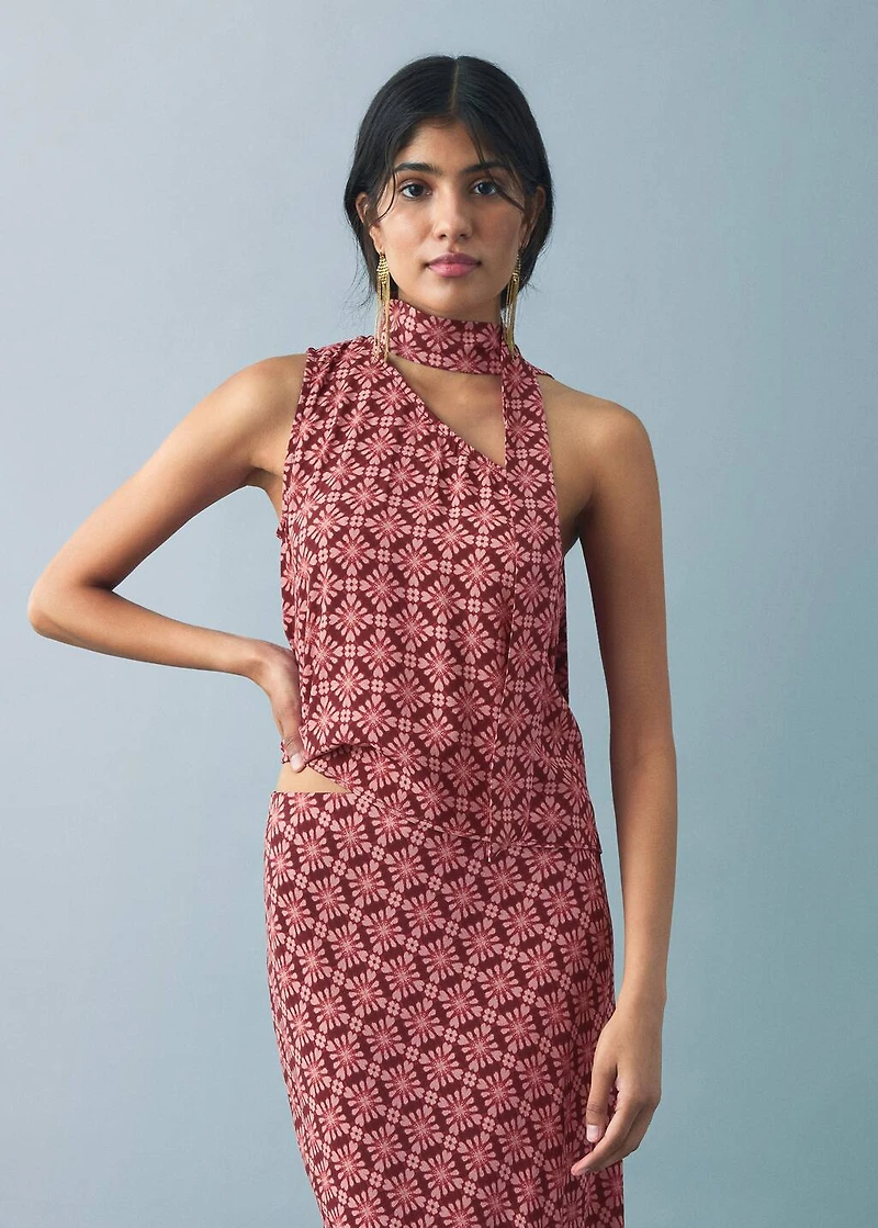 Asymmetrical blouse with bow at the neck