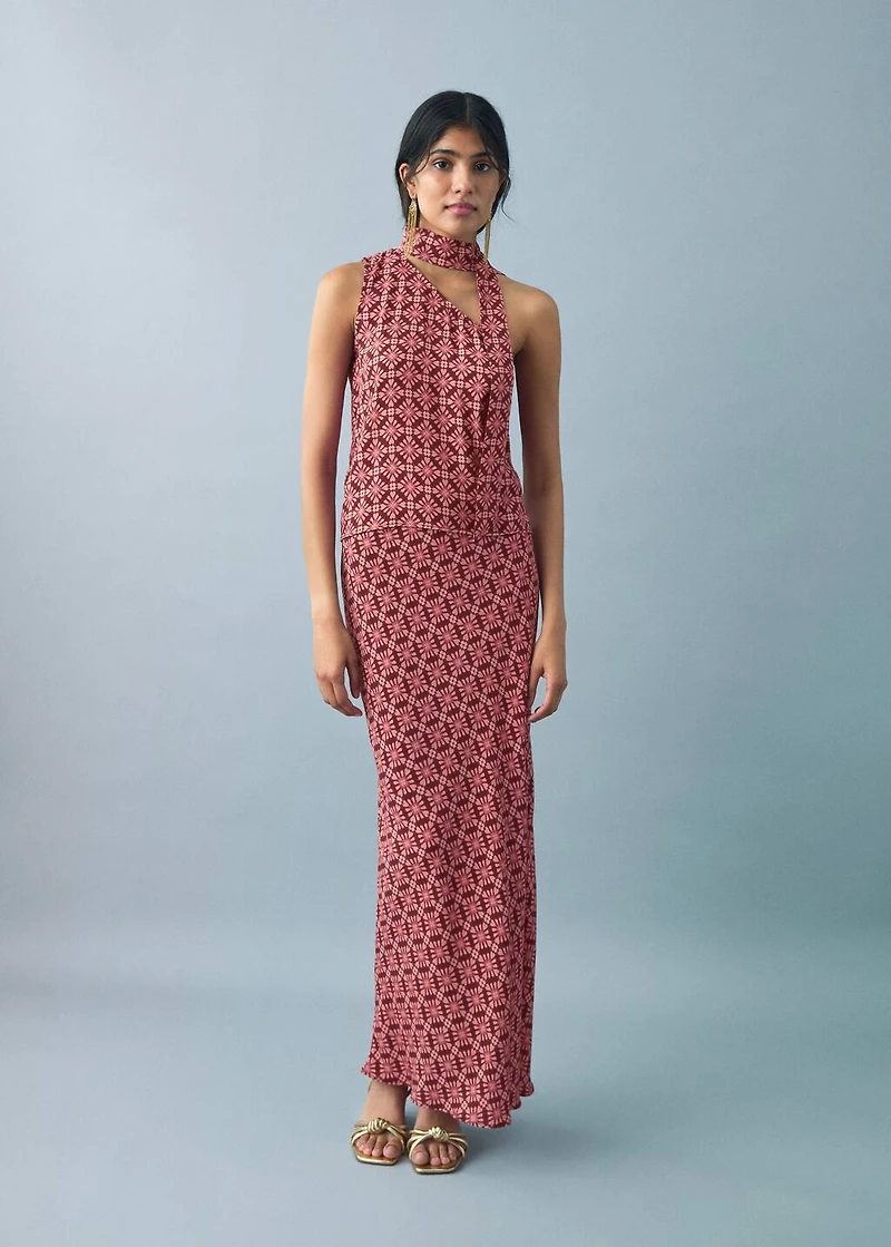 Asymmetrical blouse with bow at the neck