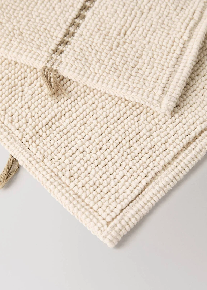 Striped bath mat with fringe detail