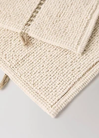 Striped bath mat with fringe detail