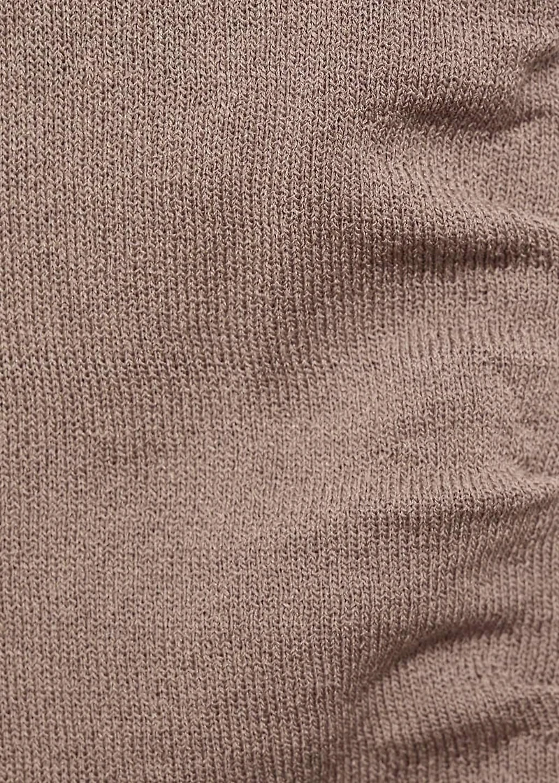 Asymmetrical knitted top with straps