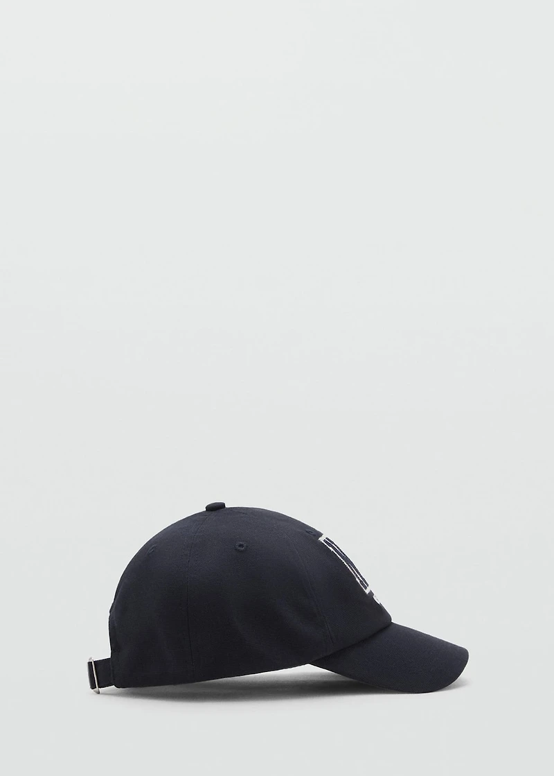 Cap with embroidered letter