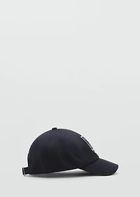 Cap with embroidered letter
